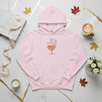 Pink hoodie with 'Fall into Gardening' text and tree graphic on a beige background