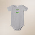 Gray baby onesie with 'New to the Patch' text and graphic on a beige background