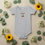 Gray baby onesie with 'New to the Patch' text and graphics on a beige background