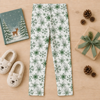 Full-length Green Snowflake kids leggings flat lay with storybook, slippers and holiday gift
