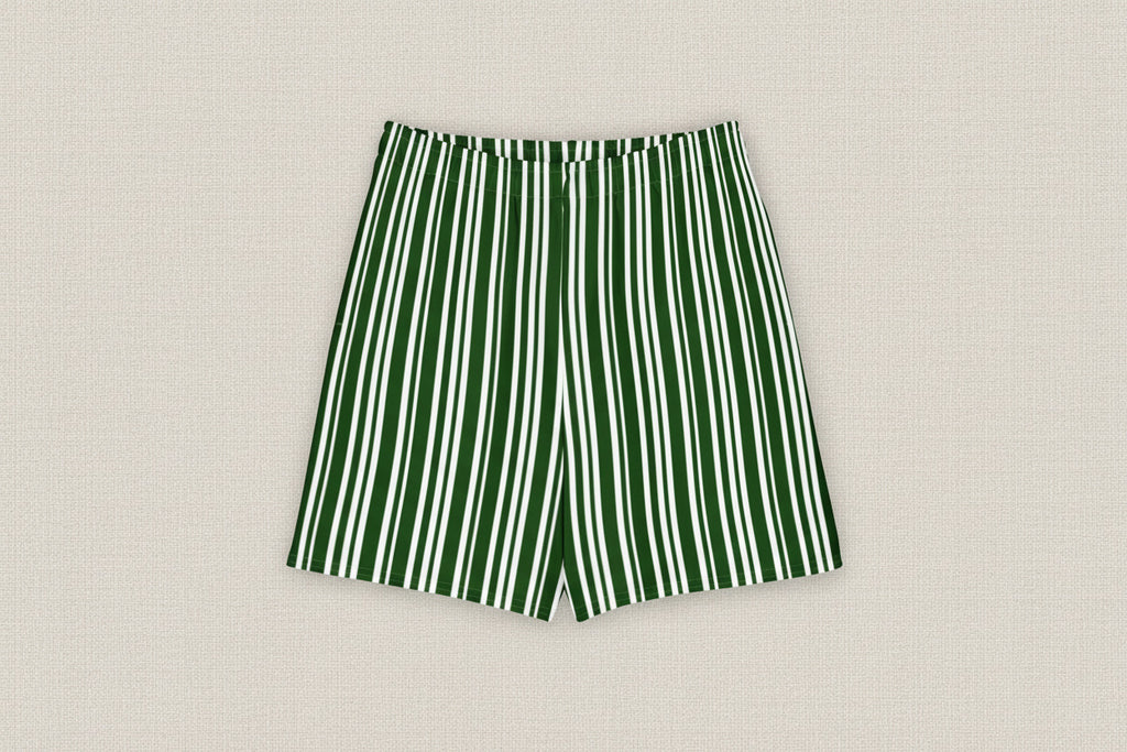 Green and white striped shorts on a light gray background