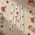 Christmas-themed leggings with a festive print of red gift boxes, green pine branches, and red stars on a white background, styled in a holiday flat-lay with stockings, a reindeer, a mug, and warm string lights.