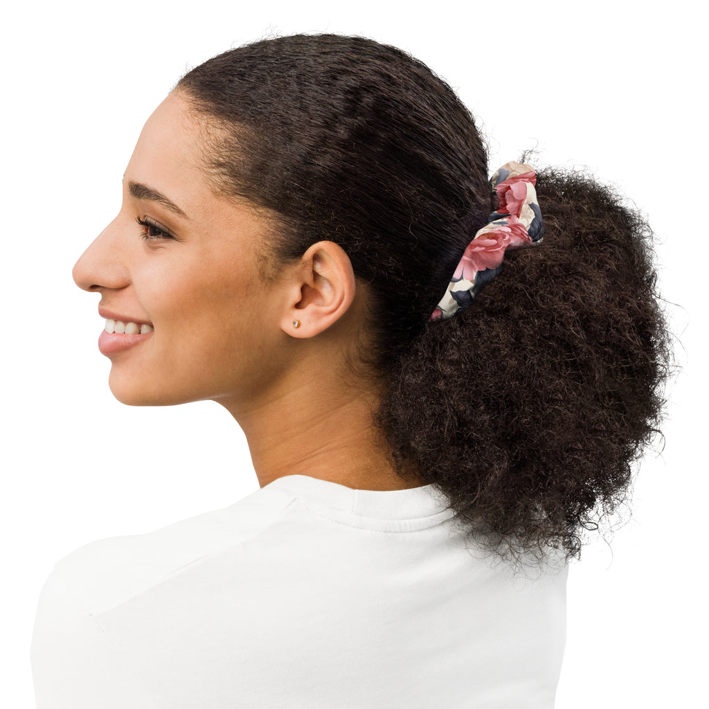 Woman with a ponytail wearing a scrunchie on a white background