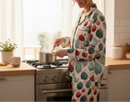 Person cooking in a kitchen wearing a patterned outfit