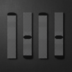 Four pairs of gray socks with black accents on a textured gray background