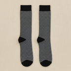 Black and gray patterned socks on a white background