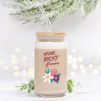 Glass tumbler with straw and floral design, featuring text 'Mom, Best Grower' on a light background.