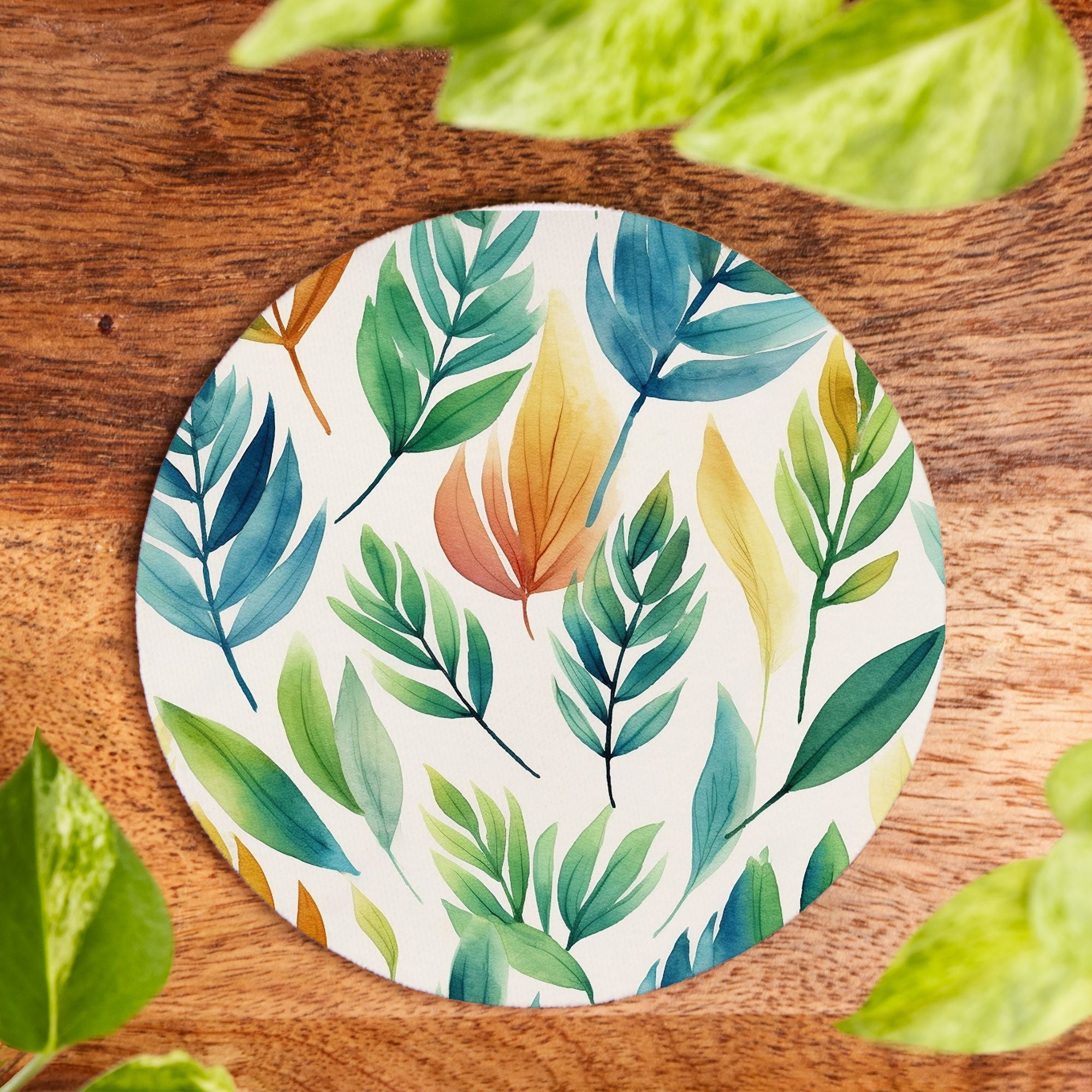 Round coaster with leaf pattern on a wooden surface
