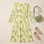 Styled flat with cream flats and a sage handbag