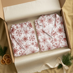 Folded Red Snowflake pajama pants and matching short-sleeve shirt in a gift box