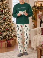 Green tee with tree pajama pants, reading a holiday card