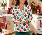Holiday pajama top with teal blue pants in a holiday kitchen