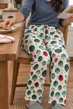 Holiday pajama pants close-up while reaching for cookies, teal bedroom slippers