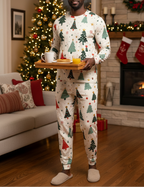 Black man wearing Blue Christmas all-over print pajamas with same-fabric fitted ankle cuffs while carrying a breakfast tray