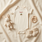 Natural cream Lil Carrot New to the Patch short-sleeve onesie styled with baby accessories