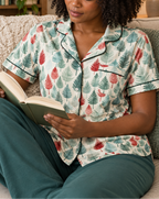 Leafy Dreams women's short sleeve pajama top while reading on a sofa