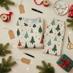Folded Blue Christmas all-over print men’s pajama top and pocketless pants with ribbon, gift tags, cookies, gifts, evergreen, and fairy lights