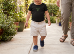 Toddler modeling the black Baby Bay Leaf onesie.
