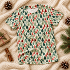 Leafy Dreams kids pajama top folded on a knit blanket with pinecones and a gift