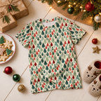 Leafy Dreams kids pajama top laid under a Christmas tree with gifts, cookies, and slippers