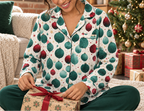 Woman opening a Christmas morning gift in holiday pajama top