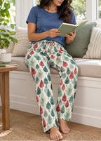 Leafy Dreams women's pajama pants reading a journal in the sunroom