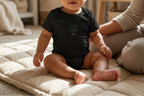 Black Grow a Little Cheer baby onesie lifestyle image