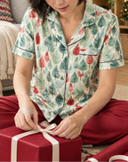 Leafy Dreams women's short sleeve pajama top while wrapping a cranberry gift
