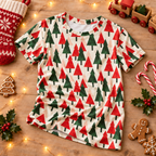 Christmas Tree kids pajama top on rustic wood with a stocking, toy train, candy canes and gingerbread