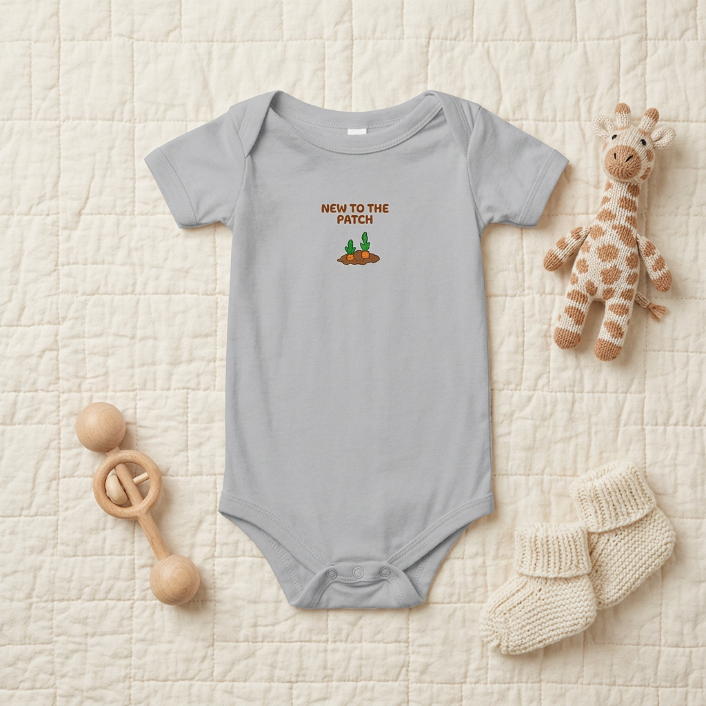 Gray Lil Carrot New to the Patch short-sleeve onesie styled with baby accessories