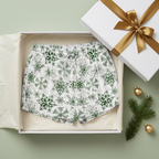 Green Snowflake women's pajama shorts with white trim in a white gift box with a gold bow