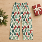 Leafy Dreams men’s pajama pants with a plain wrapped gift and fresh flowers