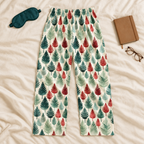 Leafy Dreams men’s pajama pants with a teal sleep mask and journal