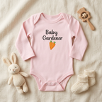 Pink Carrot onesie accessory flat lay