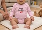 Pink Raspberry onesie on a baby in a supervised living room play area
