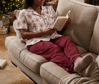 Reading with burgundy pajama pants