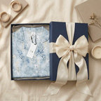 Soft blue floral pajama top with white trim folded square in navy gift box