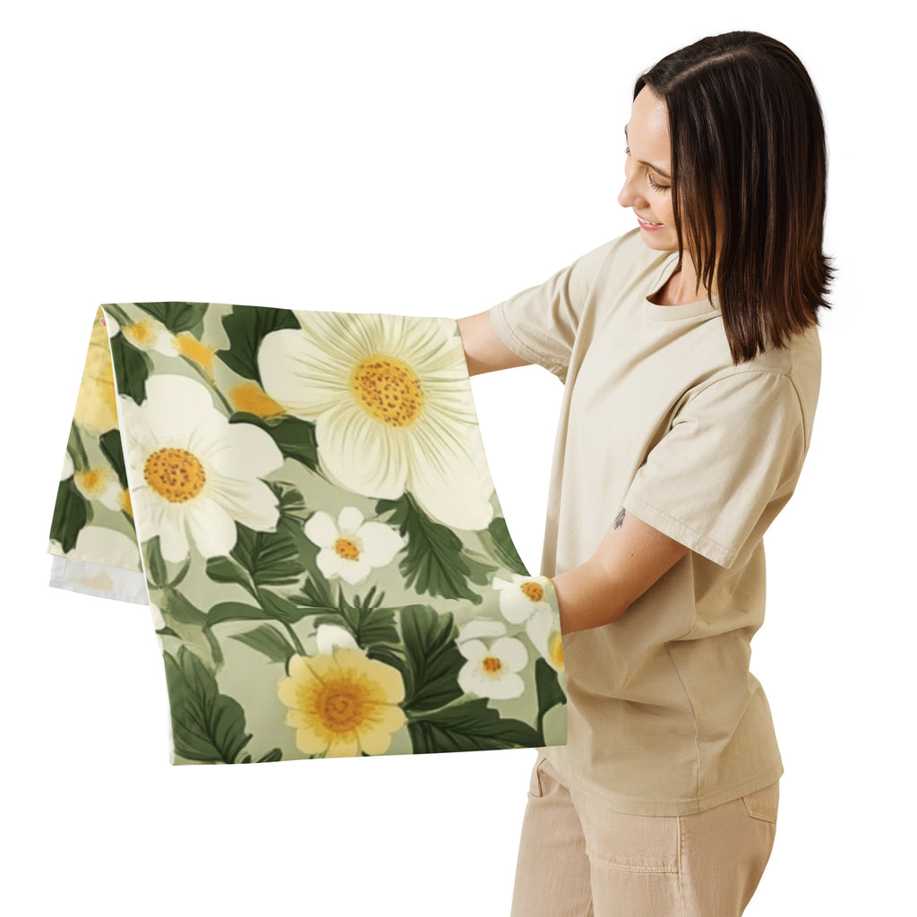 Woman holding a floral blanket with white and yellow flowers on a white background