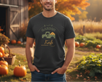 Man wearing a t-shirt with a truck graphic in a pumpkin patch