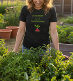 Person wearing a black t-shirt with 'Serenity equals gardening' text and a beet graphic, standing in a garden.