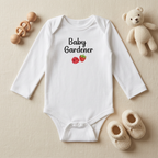 White Raspberry onesie styled flat lay