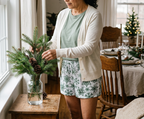 Woman arranging fir branches in a vase